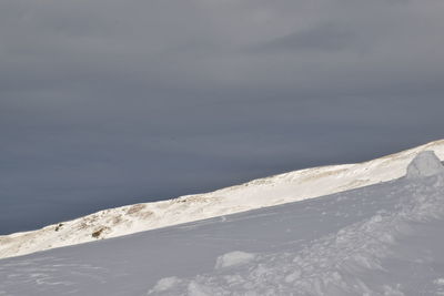 Scenic view of sea against sky during winter