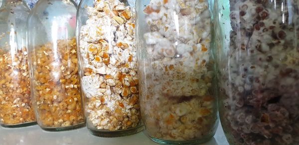 Close-up of ice cream in glass jar on table