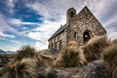 Low angle view of old building against sky, church.