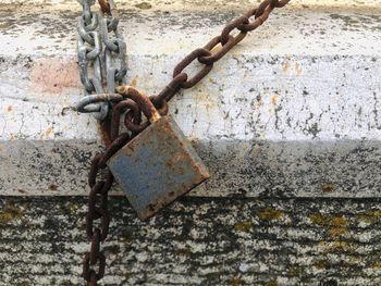 Close-up of padlocks on metal fence