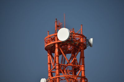 Low angle view of communications tower against clear sky