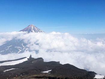 Low angle view of mountain against blue sky