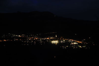 High angle view of illuminated buildings in city at night