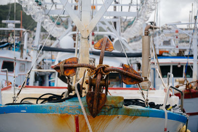 Close-up of fishing boats moored at harbor