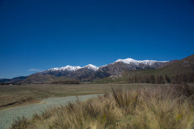 Amazing scenic view of snow capped mountains range in arthur's pass route, new zealand.