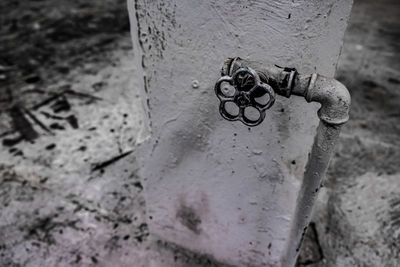 High angle view of rusty chain on wall