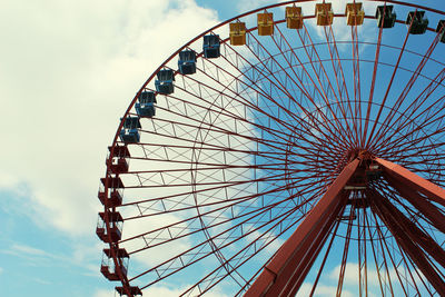 Low angle view of ferris wheel against sky