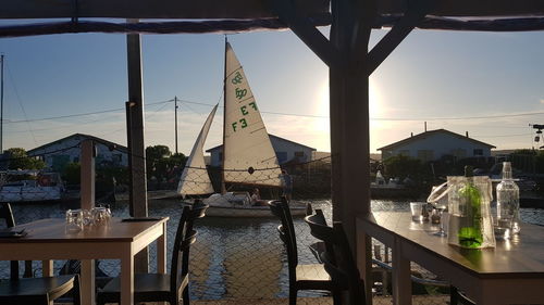 View of restaurant by sea against buildings