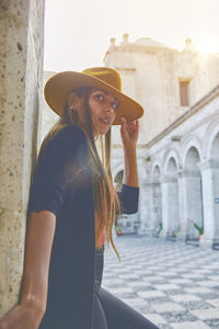 Tourist woman walking on vacation in street, arequipa, peru. selective focus