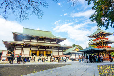 Group of people in temple against building