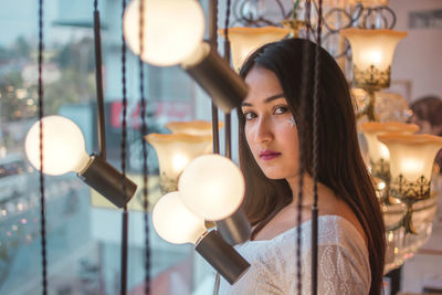 Woman holding light bulb