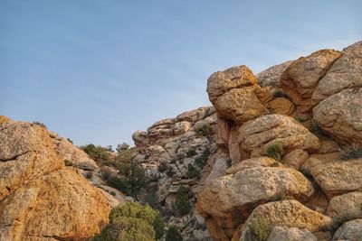 Low angle landscape of yellow and white rock formations in dinosaur national monument