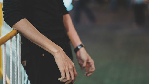 Midsection of man and woman standing on floor