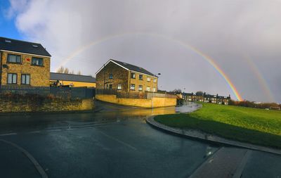 Double rainbow over residential buildings