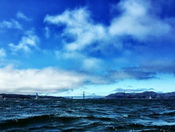 Scenic view of sea against cloudy sky