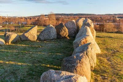 View of rocks on land against sky