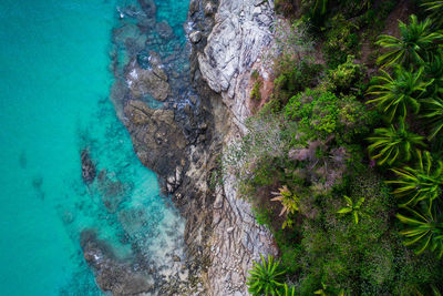 High angle view of rocks by sea