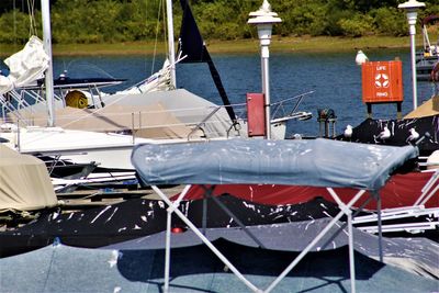 Boats moored at harbor