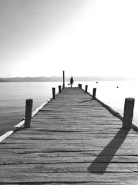 Pier over sea against sky