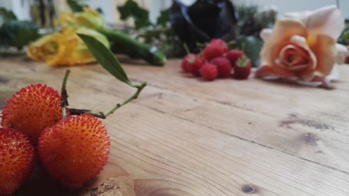 Close-up of red rose on table