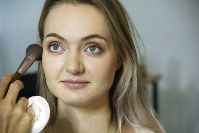 Close-up portrait of a smiling young woman
