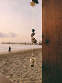 Close-up of water hanging against sky