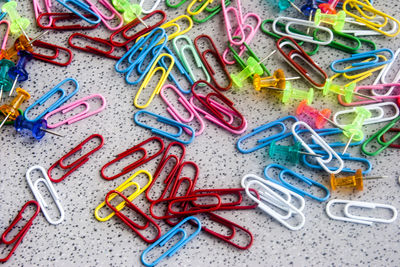 High angle view of multi colored pencils on paper