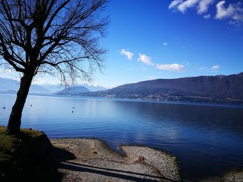 Scenic view of lake against blue sky