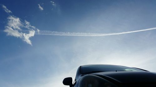 Low angle view of vapor trail against sky