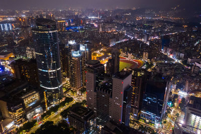 High angle view of city lit up at night