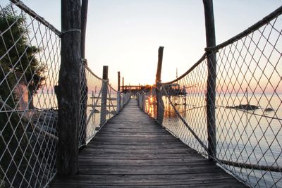 View of footbridge against clear sky