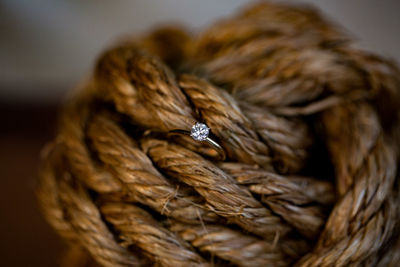 Close-up of diamond ring in rope