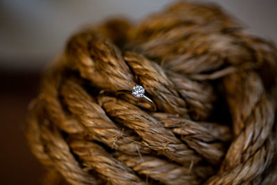 Close-up of diamond ring in rope
