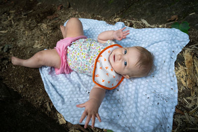 High angle view of cute baby lying down
