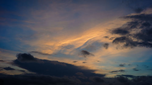 Low angle view of dramatic sky during sunset