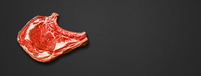 Close-up of strawberry over black background