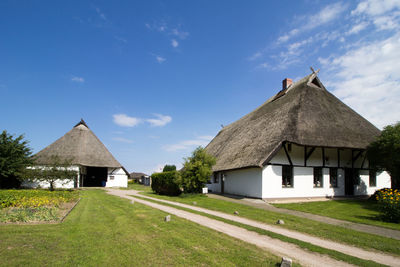 House on field against sky