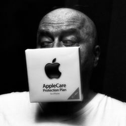 Close-up portrait of a man with text