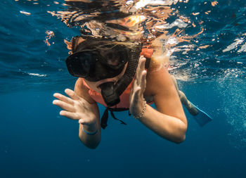 Woman doing snorkel in a whale shark tour 