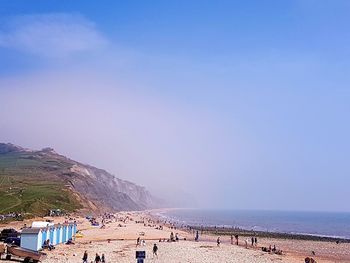 Panoramic view of beach against blue sky