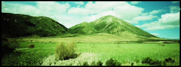 Panoramic view of lake and mountains against sky