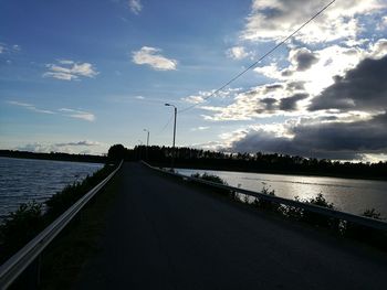 View of road against cloudy sky