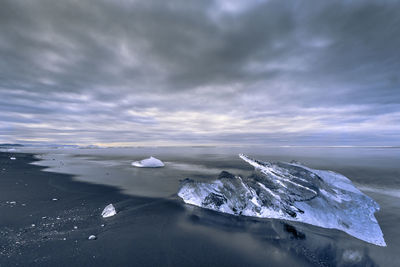 Scenic view of sea against sky during winter