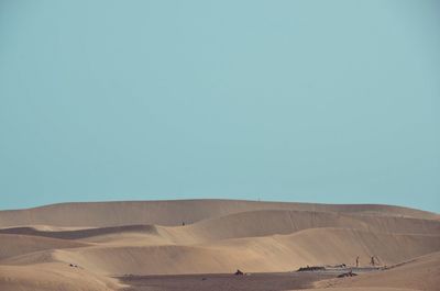 Scenic view of desert against clear sky