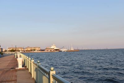 View of city at waterfront against sky