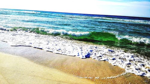 Scenic view of beach against sky