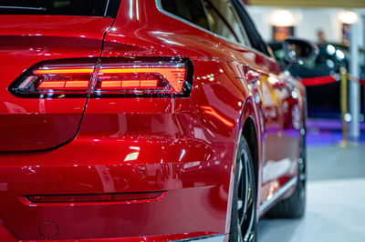 Rear led lights closeup of nev red volkswagen arteon, model 2021, stylish exterior design