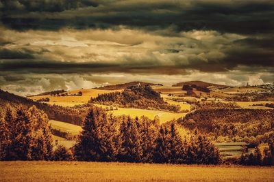 Scenic view of landscape against cloudy sky