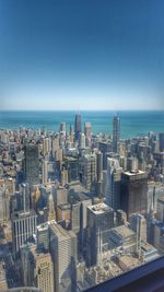 View of cityscape against blue sky