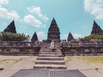 Panoramic view of temple against buildings